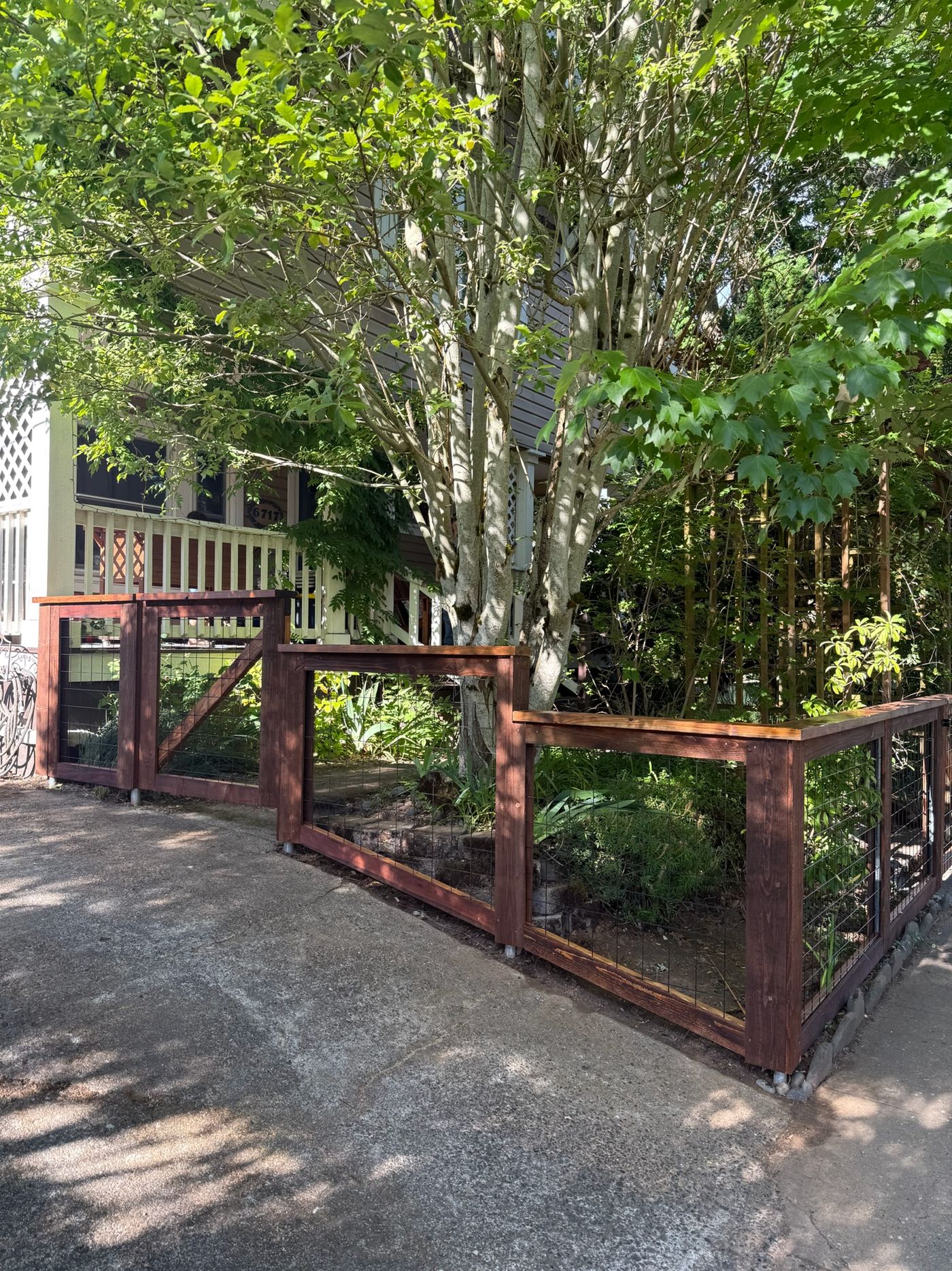 Cedar frame and welded wire panel detail on a hog wire fence in Portland, OR