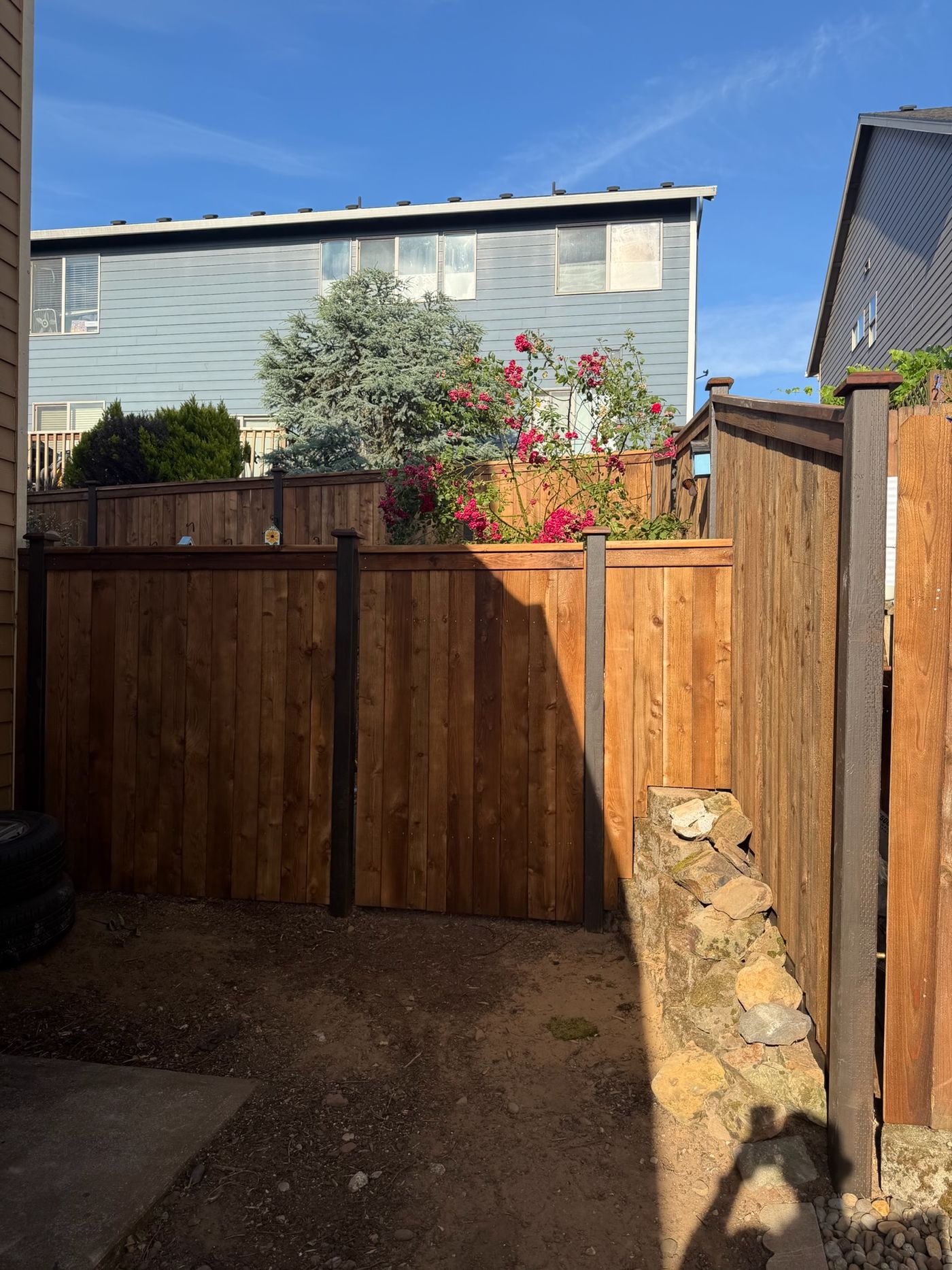 Cedar fence with black steel line posts installed by Gorilla Works in Portland, OR