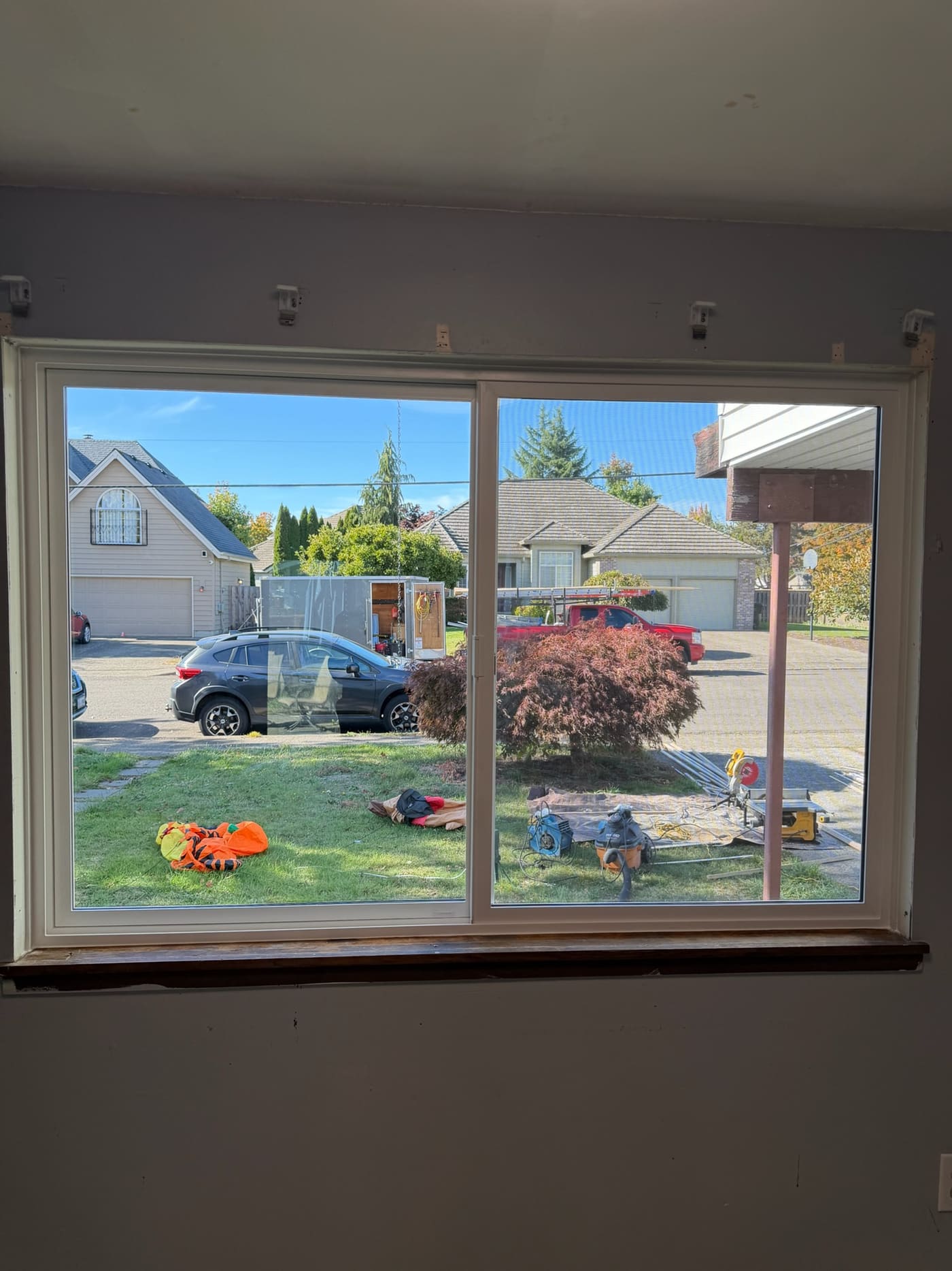 A new white slider window from the inside, installed by the Gorilla Works crew