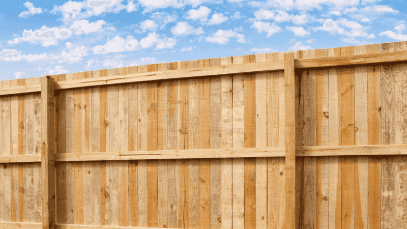 Wood privacy fence compared to a chain link fence in a Portland, OR yard