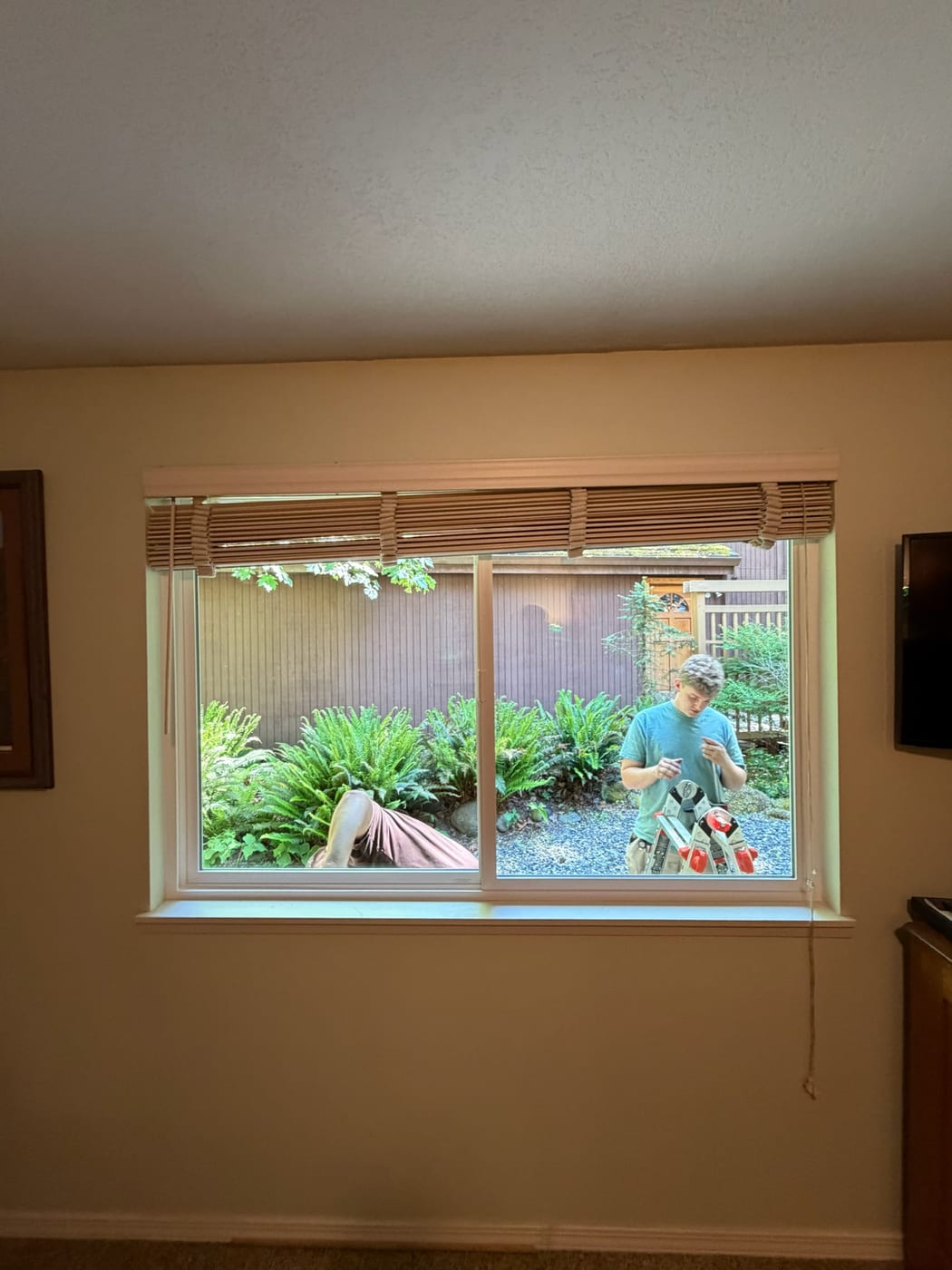 New slider window installed by Gorilla Works in a Portland OR home, seen from inside while the crew finishes outside