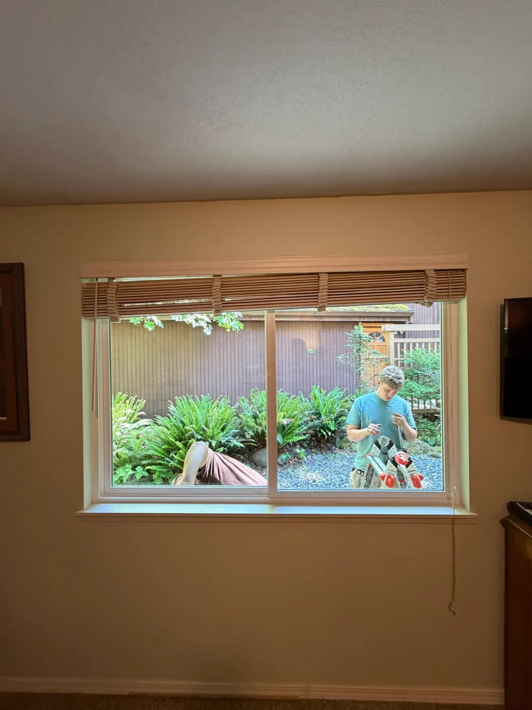 New slider window installed by Gorilla Works in a Portland OR home, seen from inside while the crew finishes outside